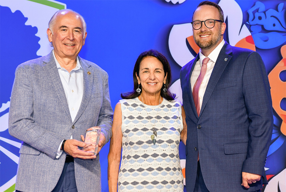 Tidwell and Renzetti accept the honor from IBAT CEO Christopher Williston.